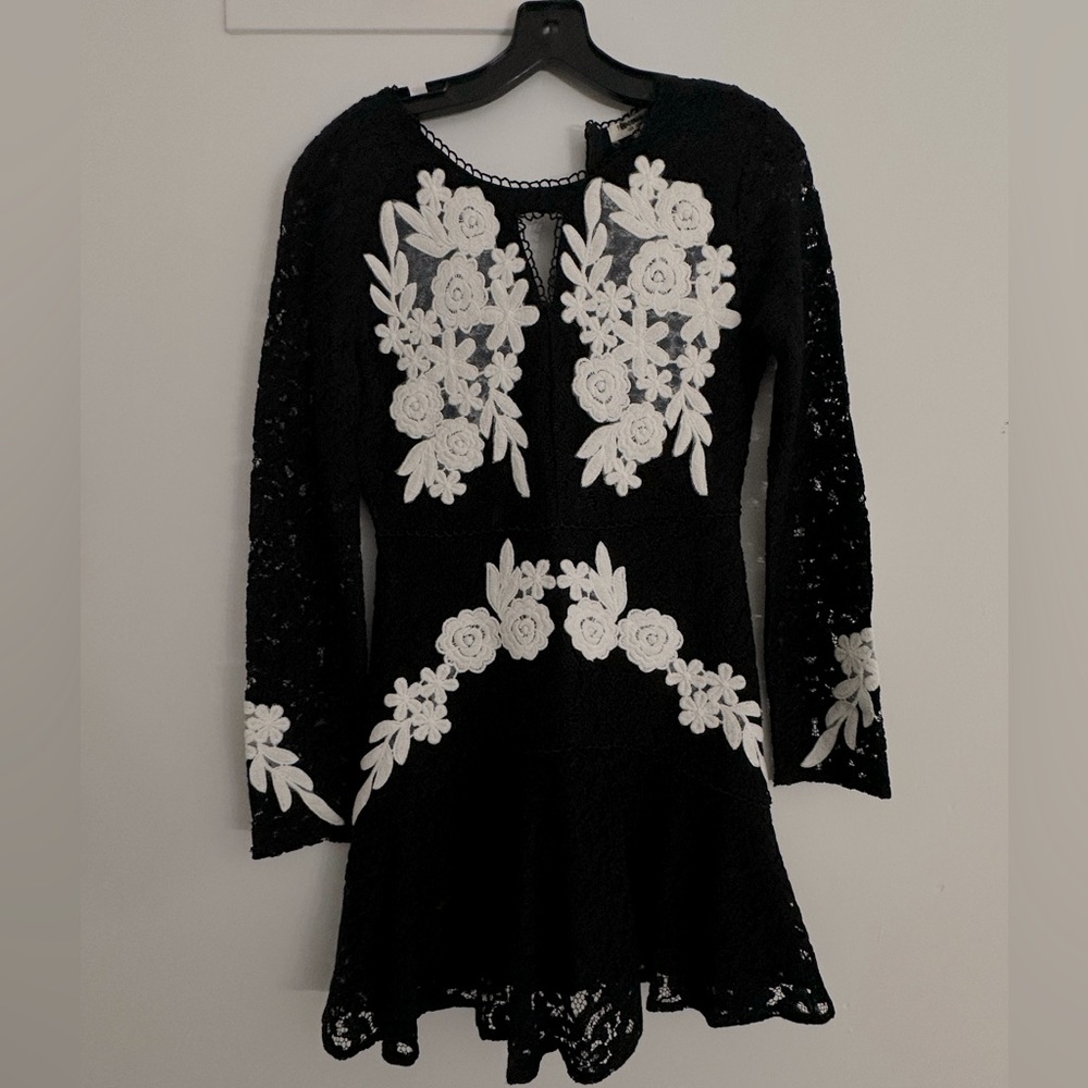 Black lace mini dress with white floral design